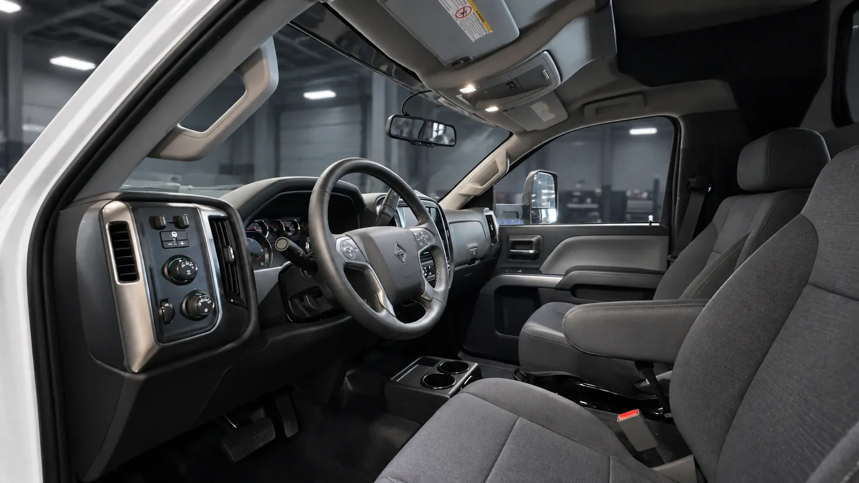 Rendering of the Frontier All Terrain cab interior, with the driver and passenger seats and the dashboard