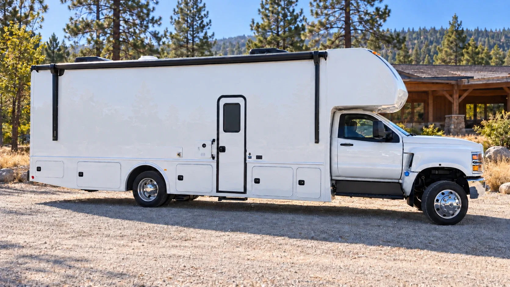 Rendering of the full Frontier All Terrain curb side, showing the entry door, exterior storage compartments and the rolled-up awning