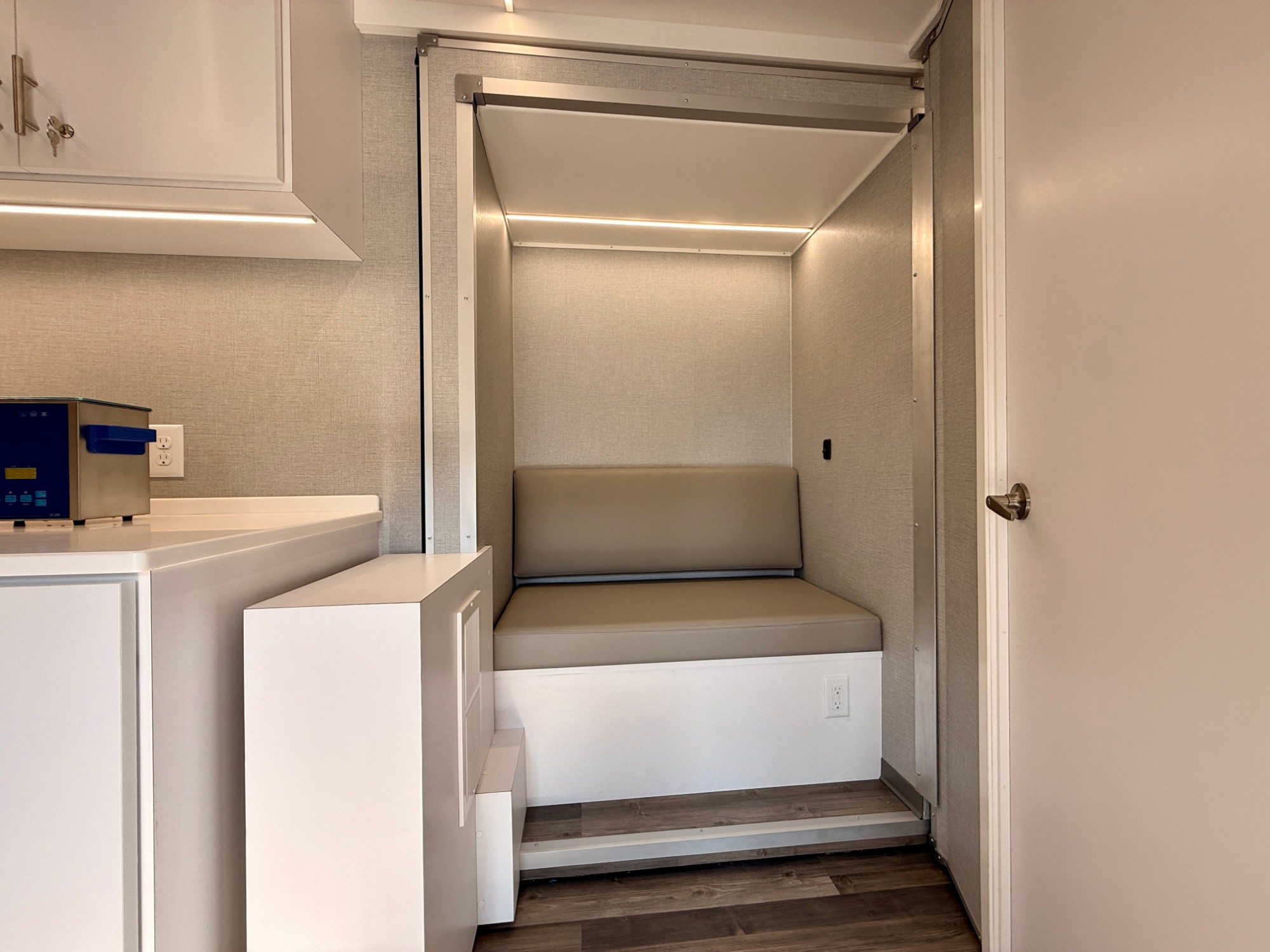 Built-in bench seating alcove beside the sterilization counter