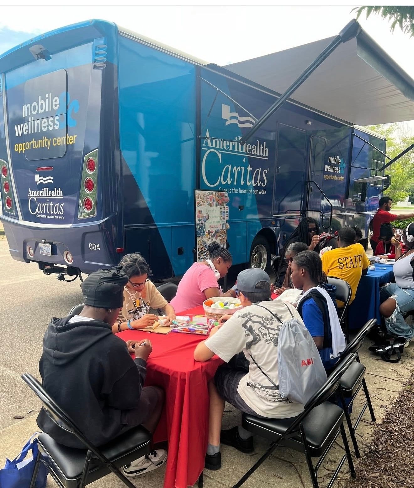 Community members at an AmeriHealth Caritas Mobile Wellness Opportunity Center event
