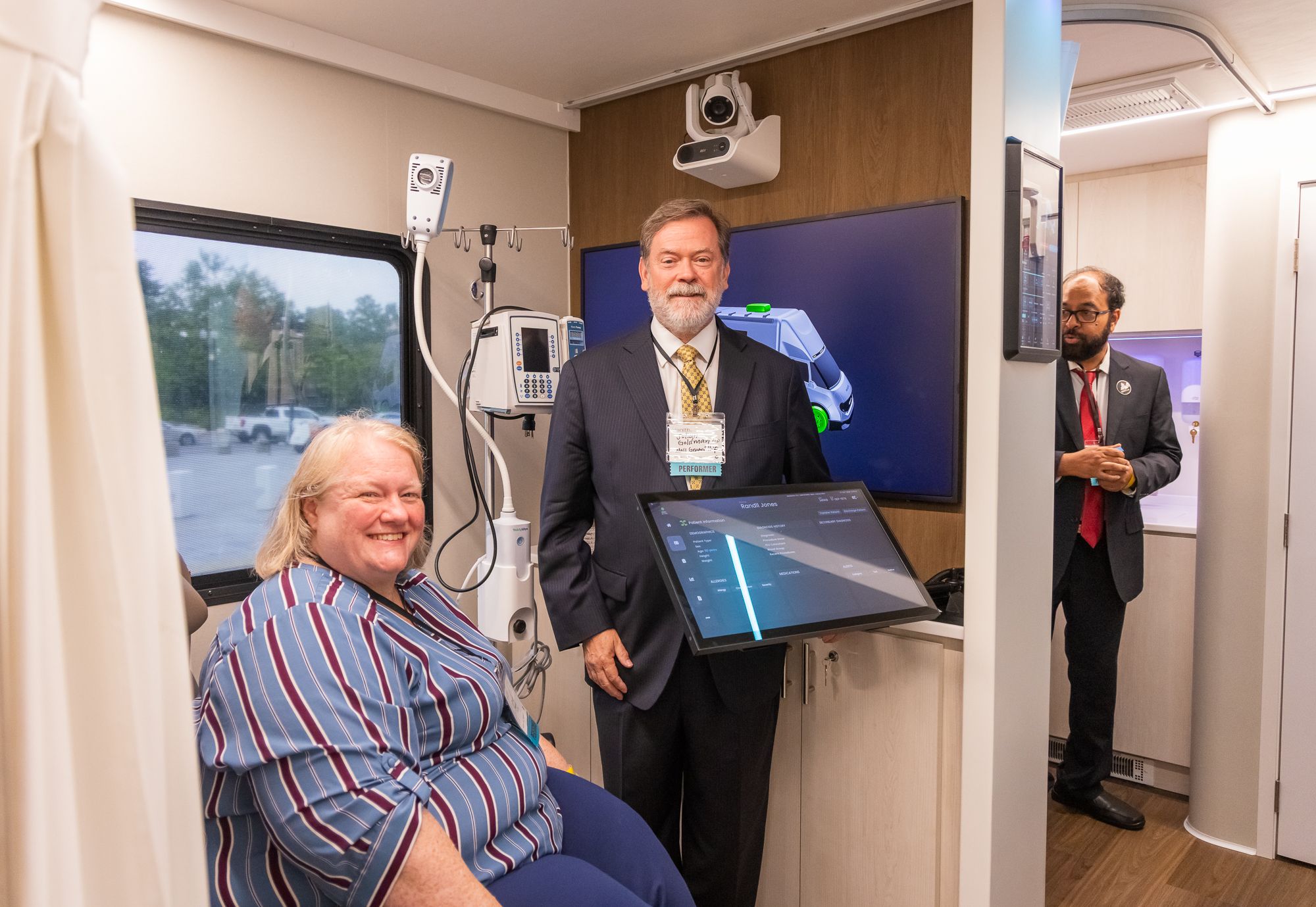 Inside the care suite during a demonstration, with the telehealth screen and camera in use
